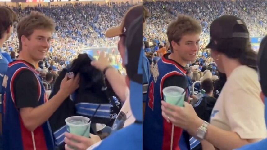 aficionada de lions obsequia jersey a joven con camiseta de