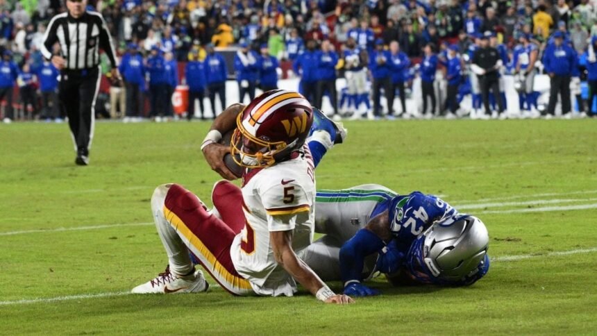 jayden daniels quarterback de commanders sufre fractura de codo durante