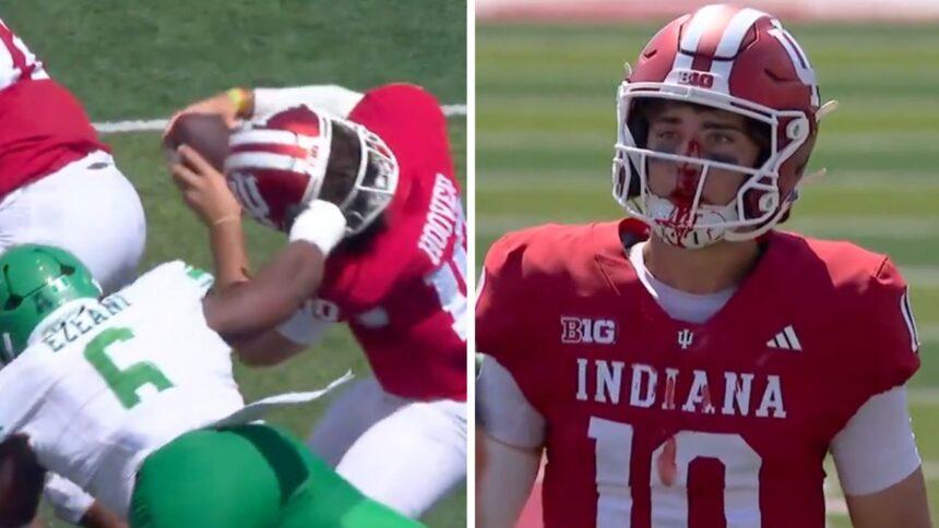 QB de Indiana: herida abierta tras jalón de máscara, pero guía victoria